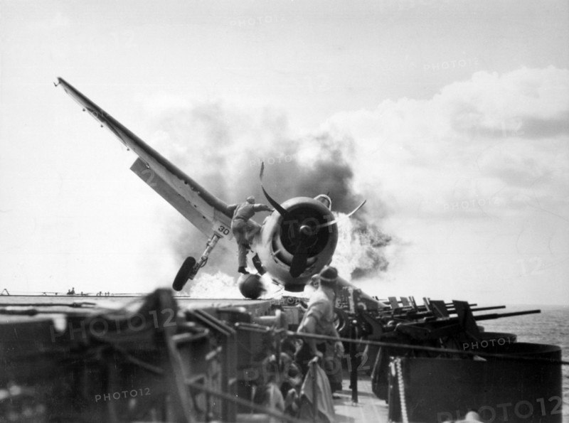 F6F Hellcat (VF-2) crash landed on USS Enterprise's flight deck. World War Two.