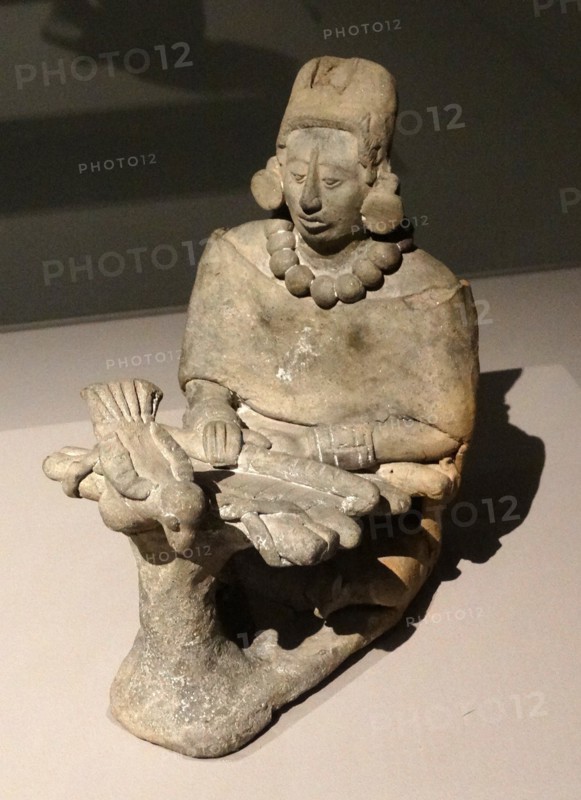 ceramic figure of an older female, depicted in a Mayan statuette