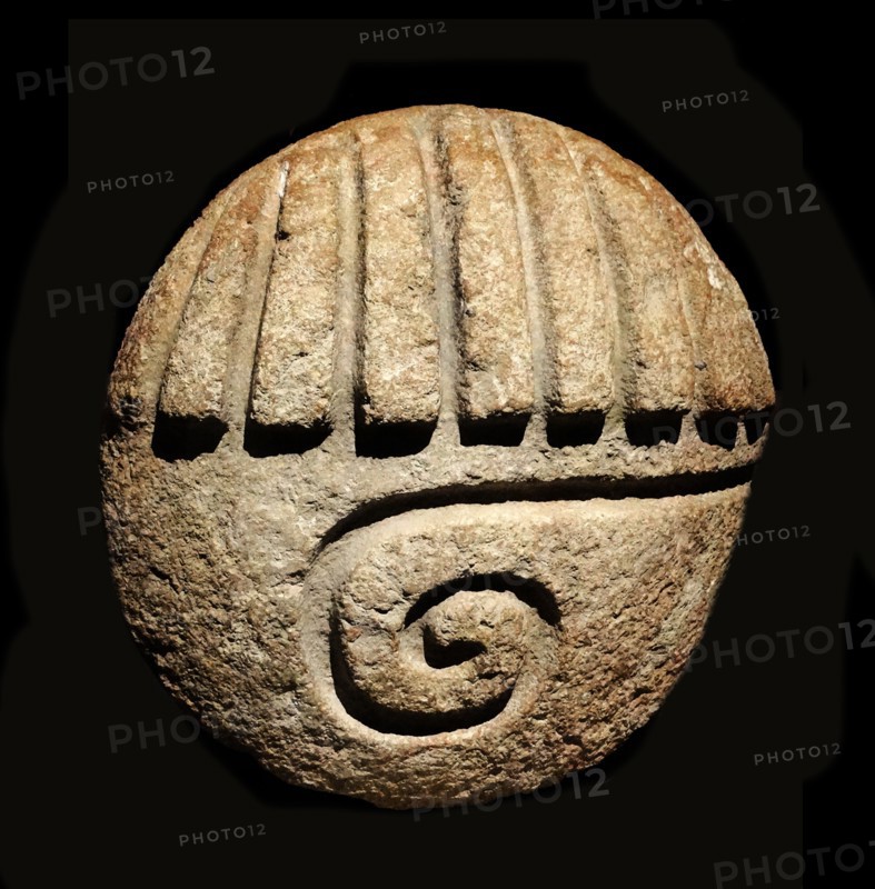 Mayan stone depicting the eye of a god