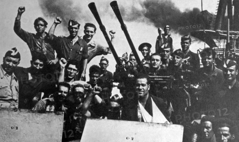 Jubilant sailors cheer on the Nationalist cruiser