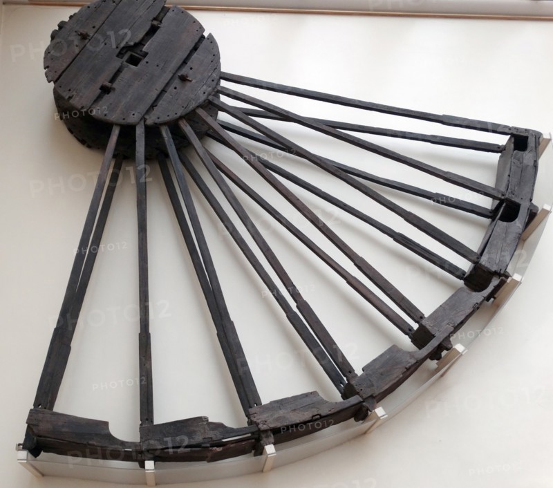 Part of a wooden wheel for draining a mine