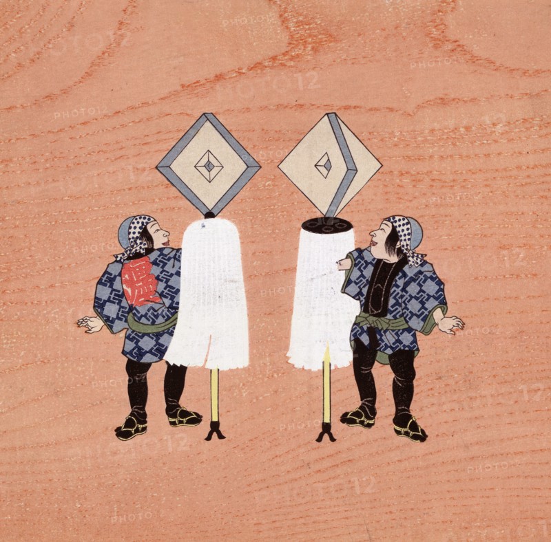 Two firemen holding the standards of their companies