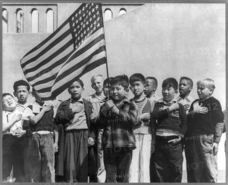 Children at the Weill public school for the international settlement saluting the flag