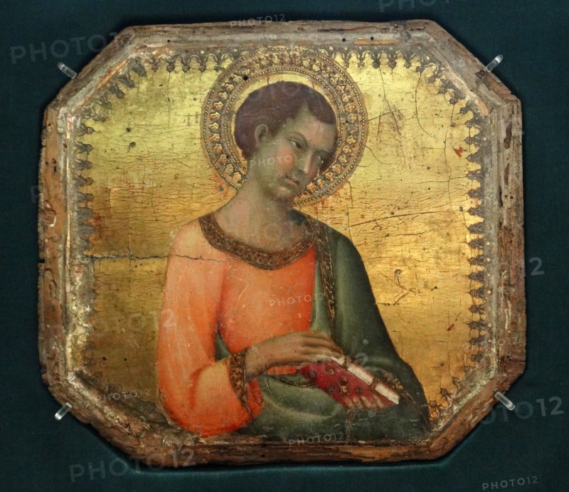 A Saint holding a book by Simone Martini