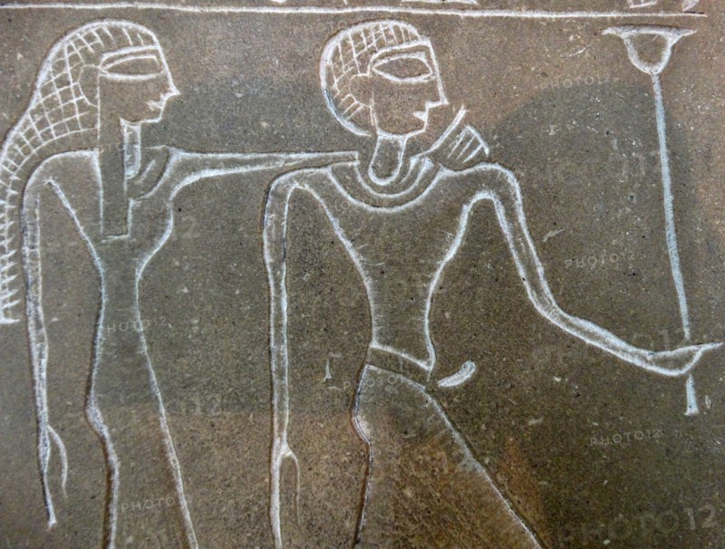 Stone tablet with reliefs and hieroglyphs