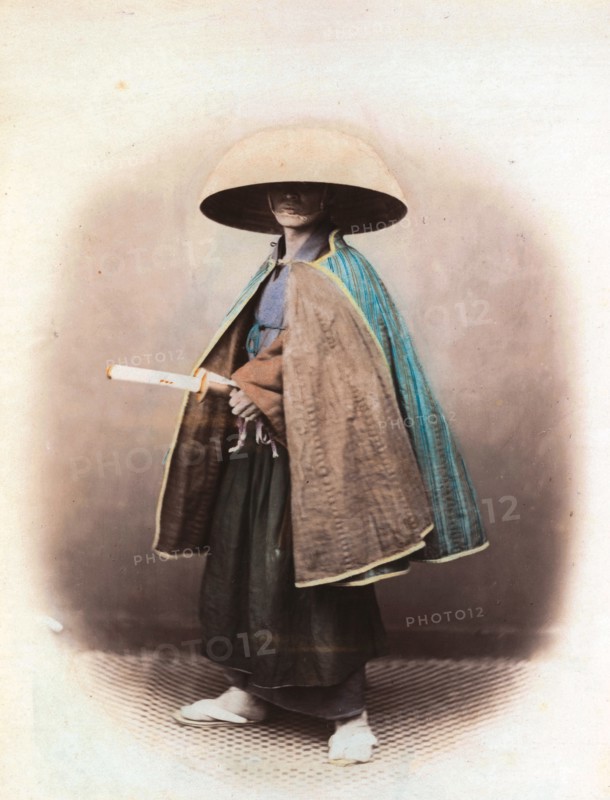 Felice Beato; portrait of a Japanese samurai, in traditional dress. 1863-68