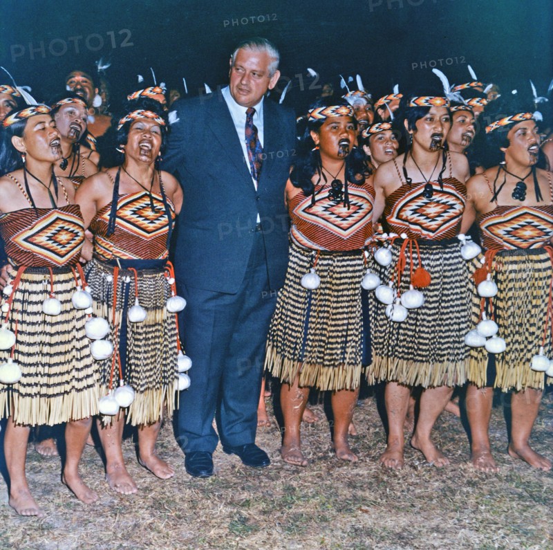 Colour photograph of Rt Hon Norman Kirk with a Maori Cultural Group