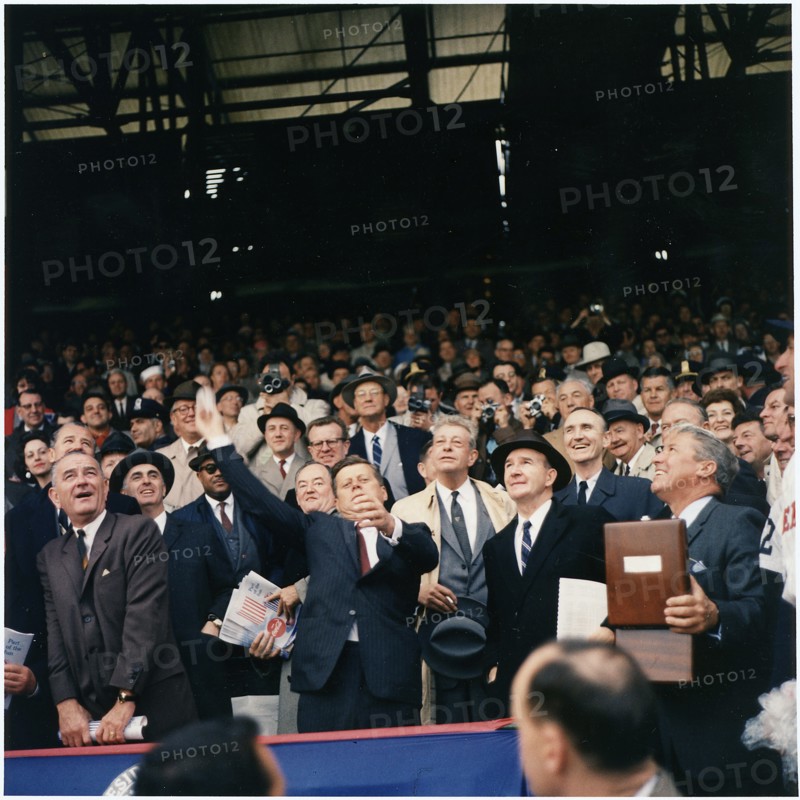 Colour photograph of President J F Kennedy throwing the first ball on opening day of the 1961 Baseball season