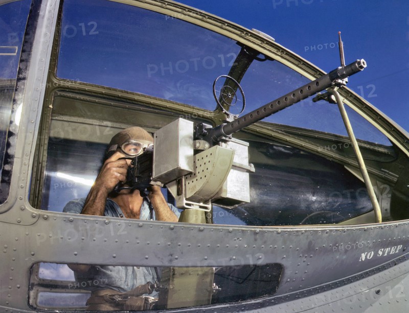 World War Two: US Navy ordnance man next to a PBY Catalina aircraft