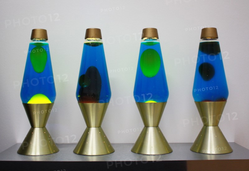 lava lamps contain blobs of coloured wax inside a glass vessel
