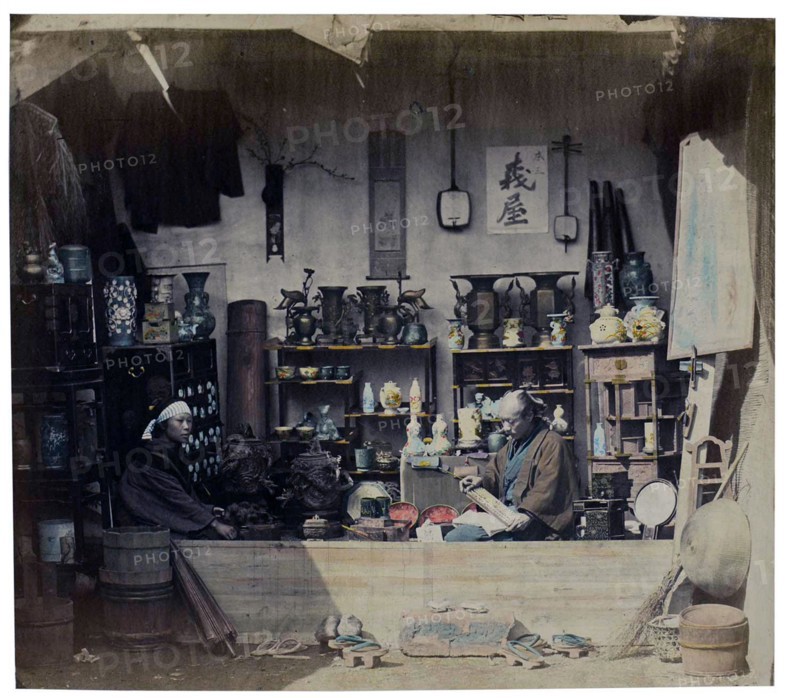 felice beato; Photograph of a Japanese shop with owners 1880