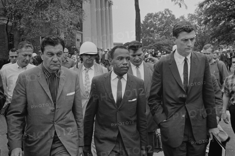 James Meredith (African-American student) walking to class following de-segregation,