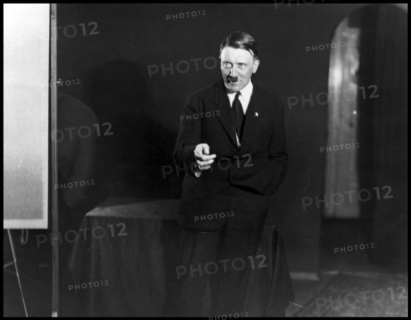 Photograph of Adolf Hitler rehearsing his speech in front of a mirror