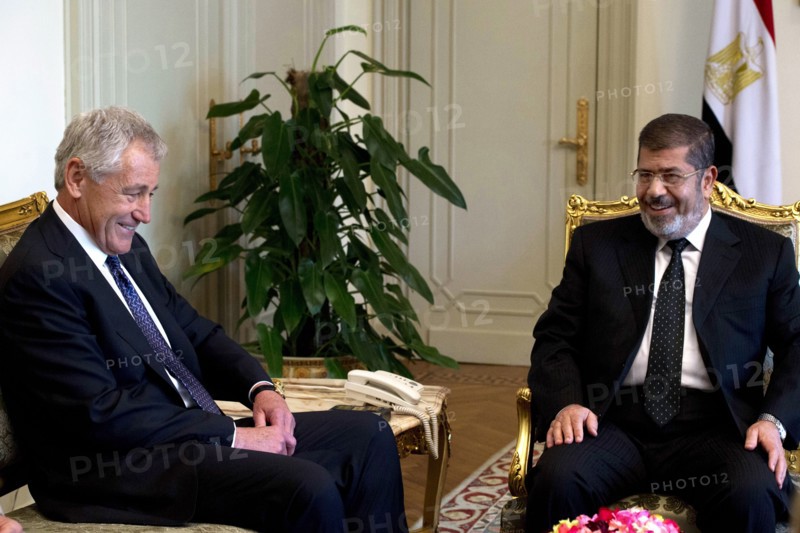 Photograph of United States Secretary of Defense Chuck Hagel meeting with Egyptian President Mohamed Morsi in Cairo
