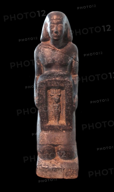 statue of a man bearing a naos with the image of the go? Harpocrates