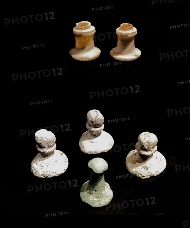 Ancient Egyptian Gambling chips made from Alabaster and limestone. New Kingdom 1550-1070 BC