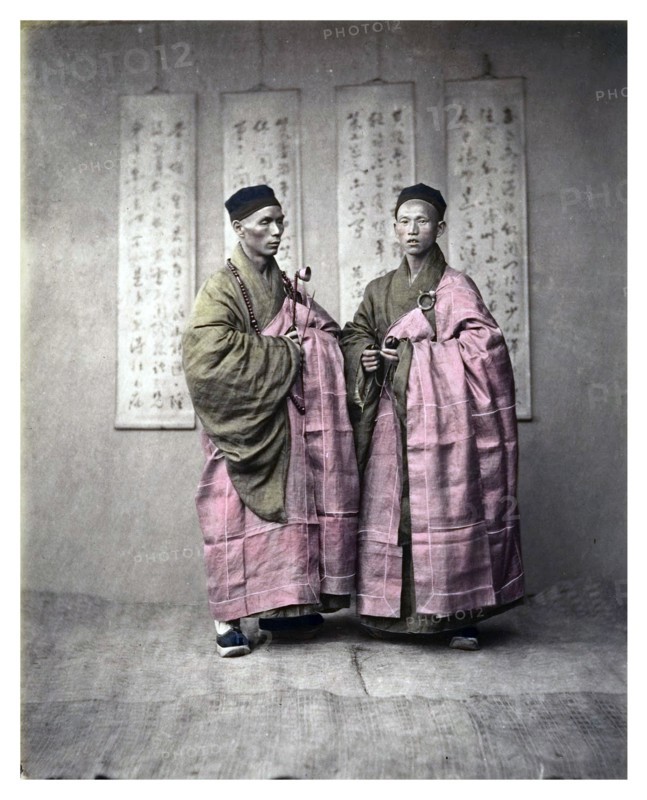 Chinese men in matching traditional dress, c, 1870s