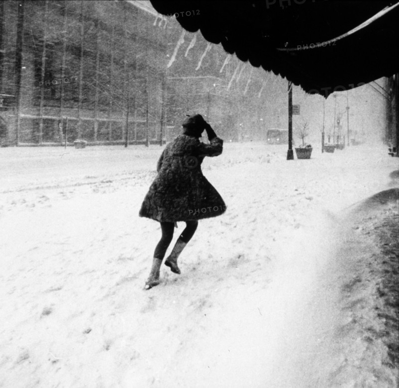 Woman walking in 16 inches of snow in Manhattan