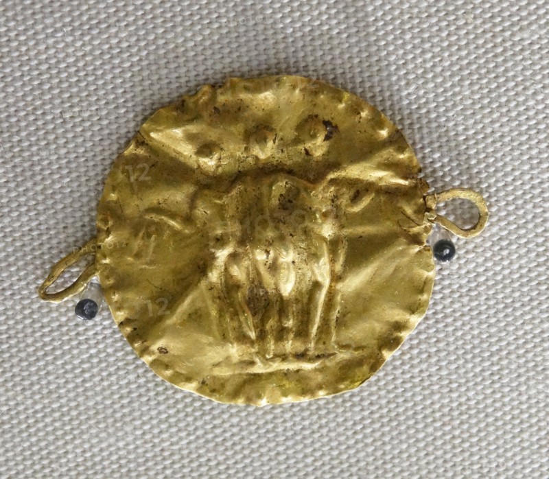 Gold disc from a necklace