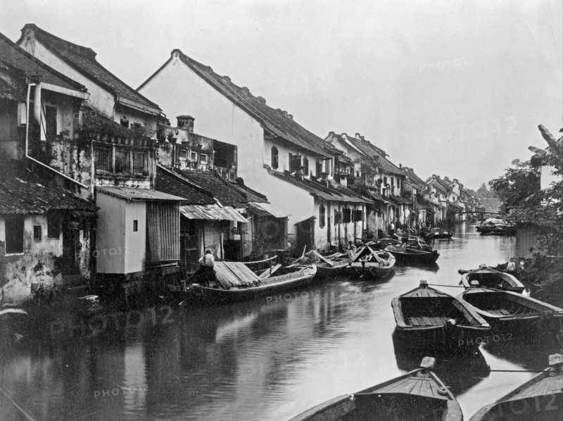 Small boats on the village canal in Java