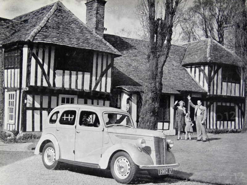 Photograph of a typical 1950s family outside of their home