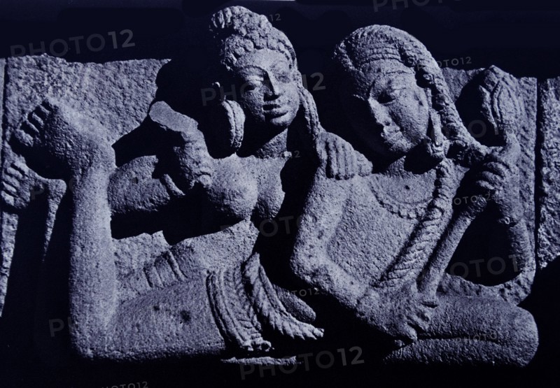 Vidyadharas floating with lotus flower.