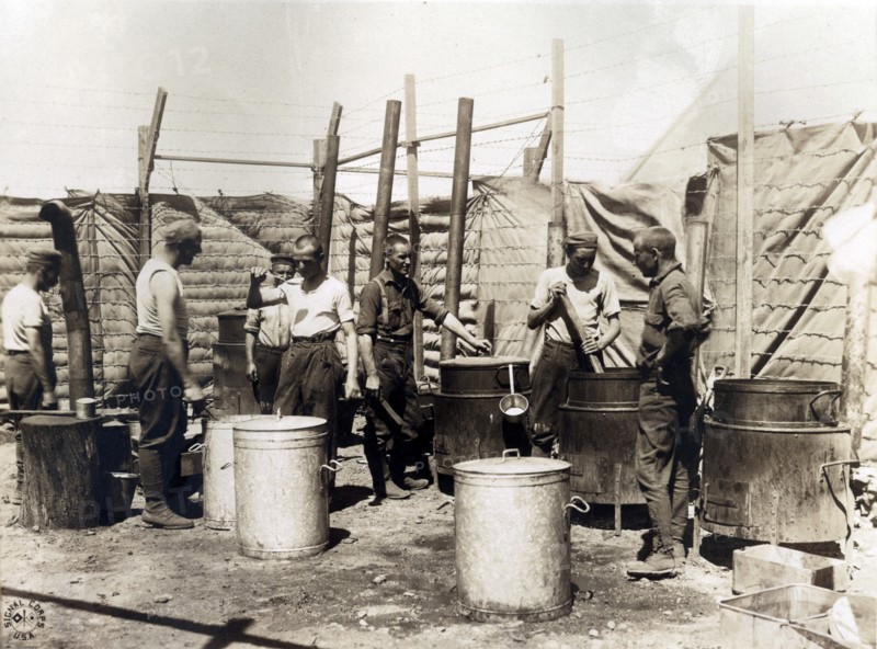 The open air kitchen used by German prisoners while a new mess hall and kitchen is being erected at Camp Miramas