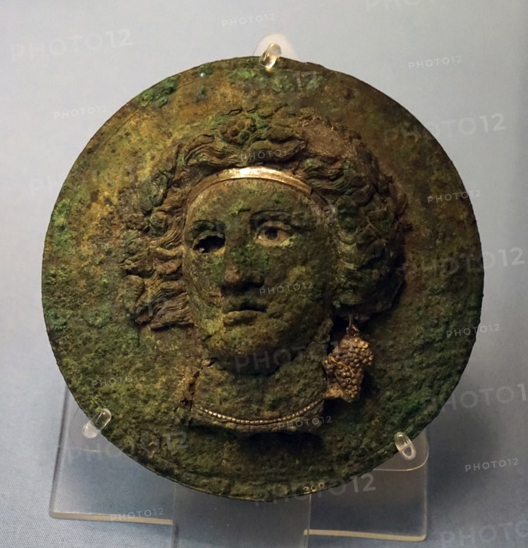 Bronze mirror cover with the head of a maenad or Ariadne