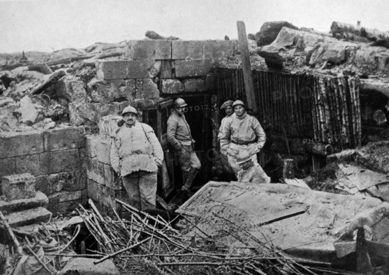 Victorious French Soldiers in front of a disused shelter in Bailly