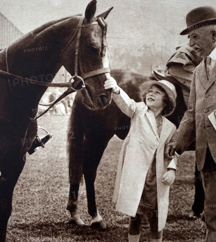 Princess Elizabeth stroking a winning horse