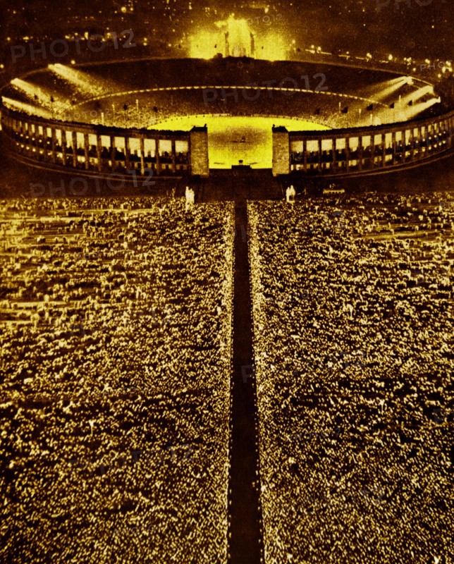the large crowds gathered within the Berlin Stadium celebrating the visit of Benito Mussolini