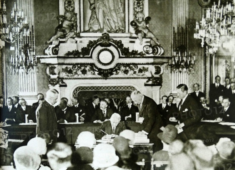 Frank B. Kellogg signing the KelloggñBriand Pact