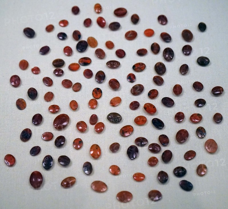 Engraved carnelian gems awaiting to be set into rings
