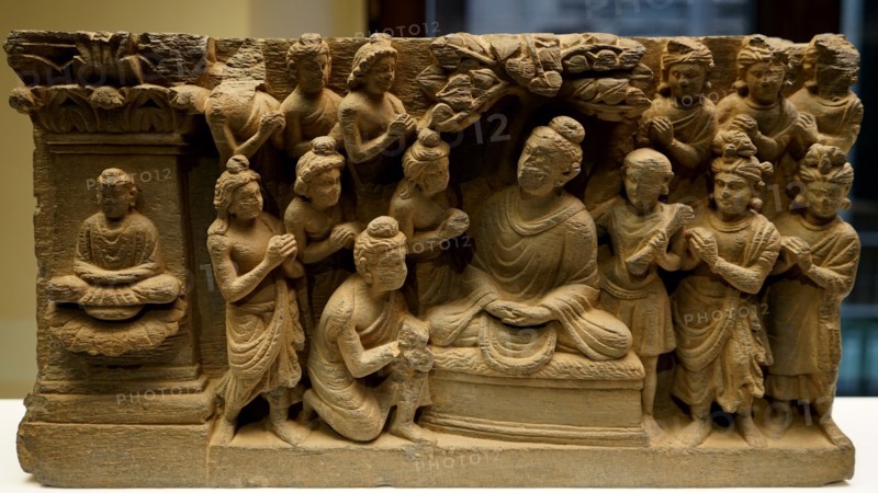 Gandhara Buddha accompanied by devotees