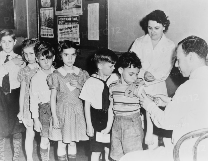 Health in a U.S. city is a concern as children await inoculation and immunization shots