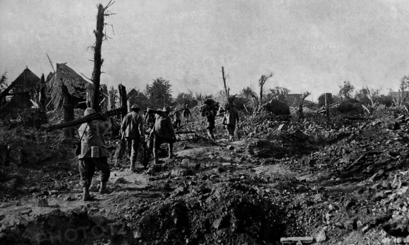 The remains of Dompierre as French forces pass through.
