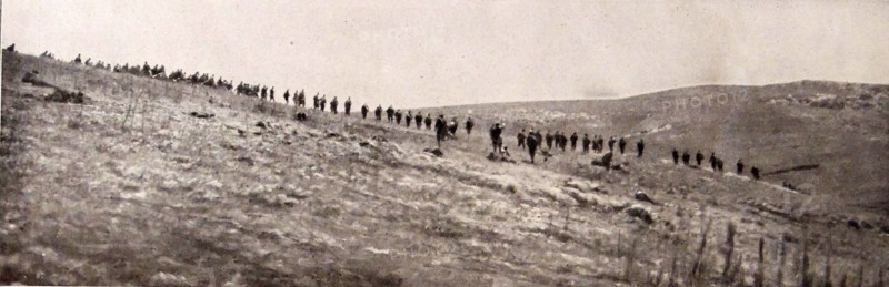 Serbian infantry take up position on a hillside.