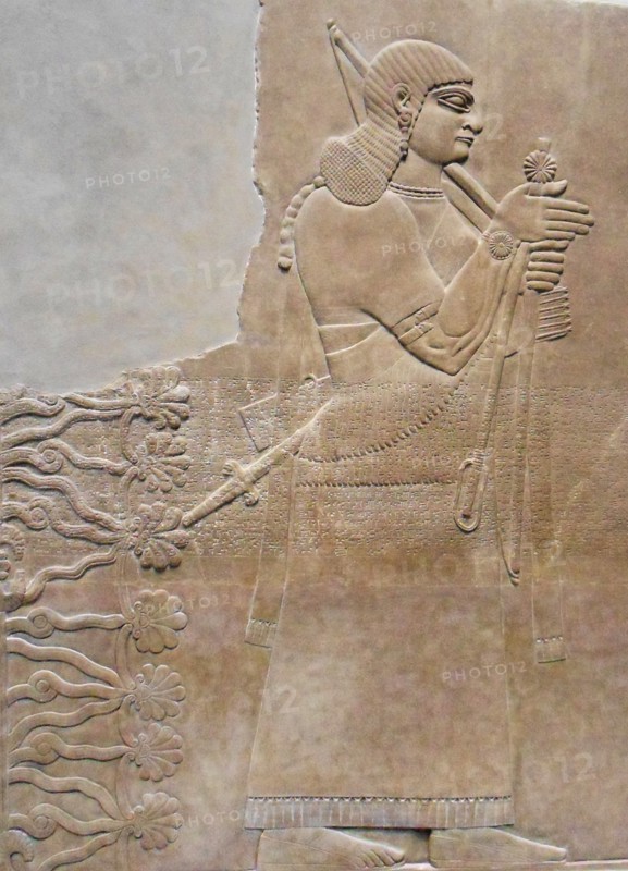 relief depicting a king and eunuch attendant