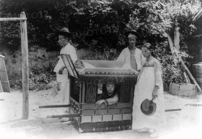 Korean noble boy carried by servants in a sedan chair 1900