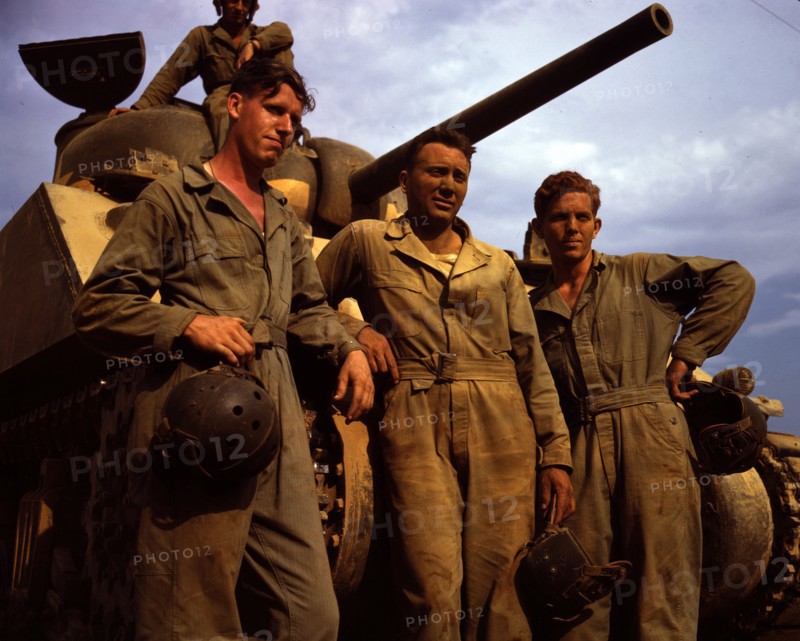 US Army tank crew standing in front of an M-4 tank