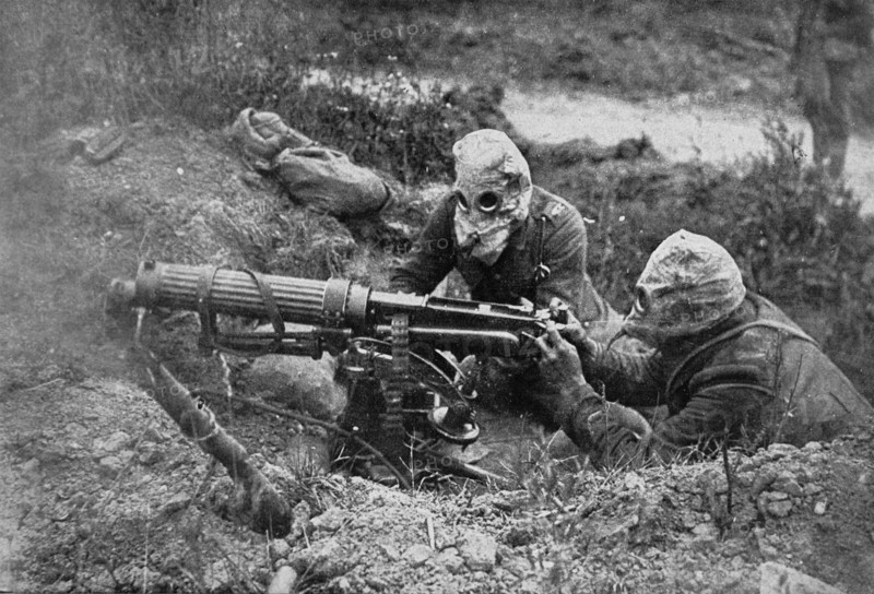 WWI. British gunners wear helmets as protection against gas attack