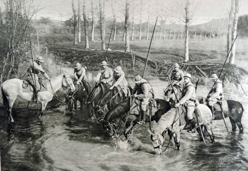 French cavalry horses drink at a river