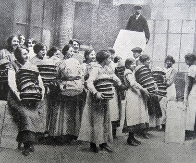 Loading soldiers helmets for delivery to the front line