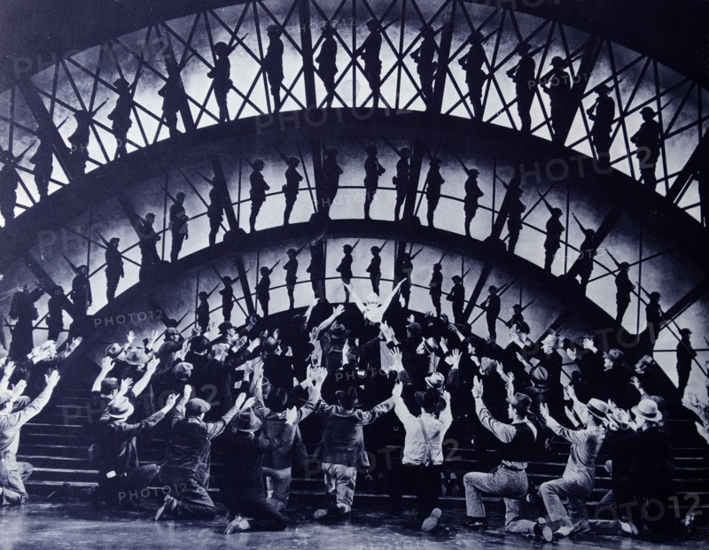 "Gold Diggers of 1933".  Joan Blondell sings "Remember My Forgotten Man" to a chorus of the unemployed, while behind her in silhouette we see the same men when they were fighting in WWI for the country which neglects them now.