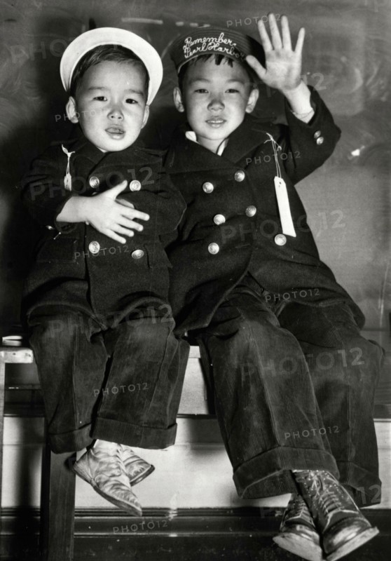 Japanese children waiting for a bus