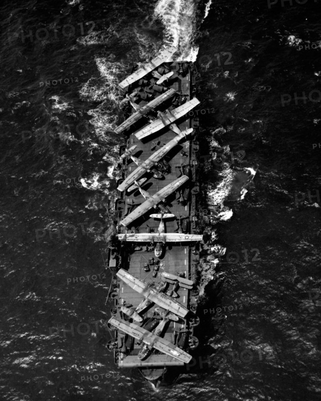 Planes aboard the deck of the USS Thetis Bay