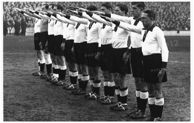 1936, Germany Versus England. German team give the Nazi salute at the Berlin Olympic games