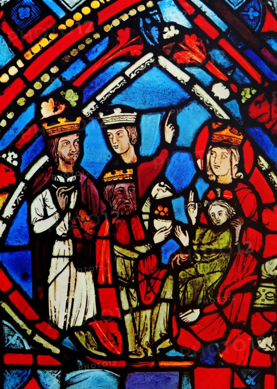Stained glass window depicting the adoration of the Magi. Dated 13th century.