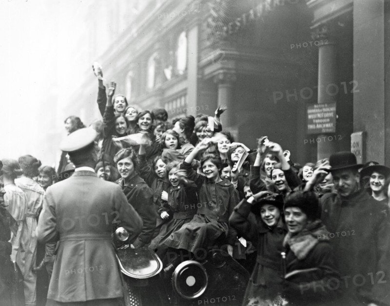 London; England. crowds celebrate the Armistice at the end of WWI 1918