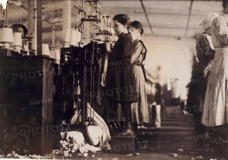 Photograph of a young girl employed as a knitter